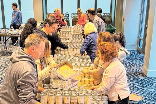 Volunteers from Temple Beth-El organized and packed donations for holiday meals for over 300 families. (Contributed photo)