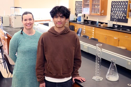 Melvin Thu is congratulated by Jessica York, science department chair/science research director at North High School. (Contributed photo)