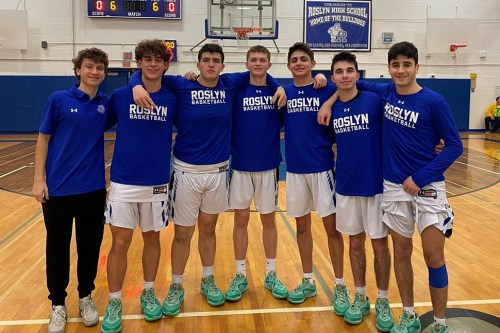 Varsity boys basketball  players at their senior recognition ceremony.  (Photo courtesy of Roslyn High School Athletics)