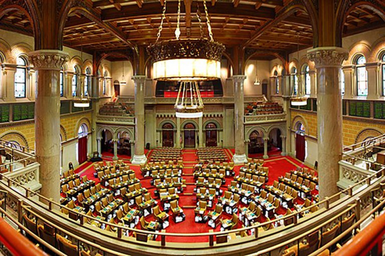 New_York_State_Assembly_Chamber New York State Assembly Chamber in Albany (Image via Matt Wade, Wikimedia Commons)