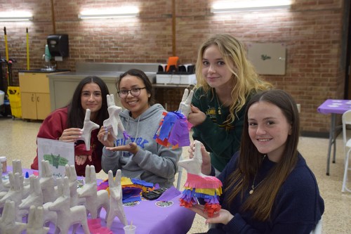 SCHOOLS_international_032724_A Locust Valley High School students Elizabeth Ardi, Helen Serrano Vega, Katie Kuebler and Ashley Grella decorate miniature piñatas at the Locust Valley Central School District’s International Night on March 6.
(Photos courtesy the Locust Valley Central School District)