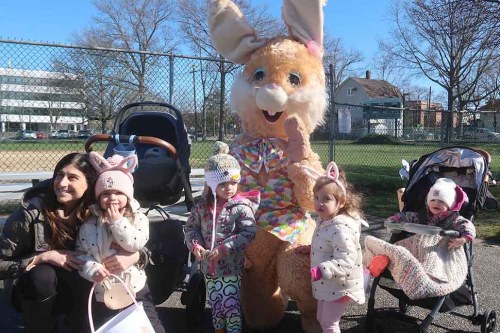 The Easter Bunny posed with egg-seekers at the Village of Westbury's annual Easter Egg Hunt. (Credit: Ray Muntz)