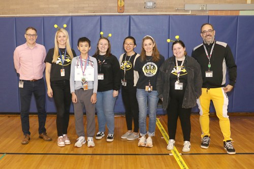 North Middle School sixth-grader Victor Yang is congratulated by the North Middle English faculty following his win at the school spelling bee in January. (Contributed photo)