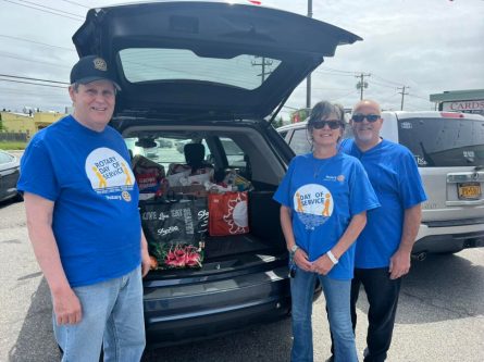 CoverImage Rotarian Dr. James Bentson, volunteer Linda Morales and Rotarian Robert Mancino organizing donations to be delivered to local pantries