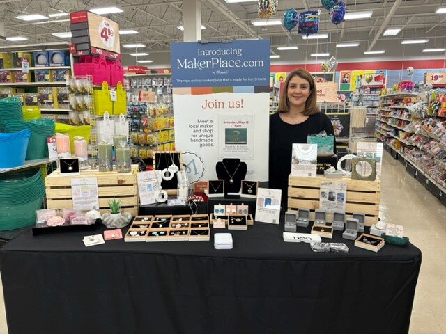 Farnaz at her booth. (Photo courtesy of Farnaz Menhaji)