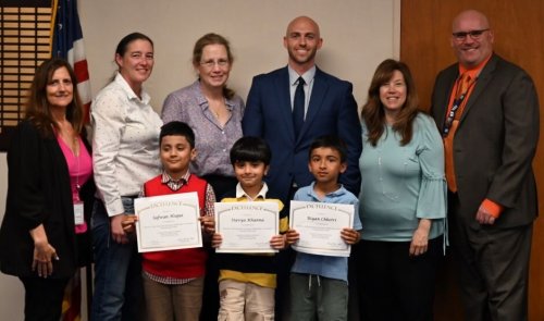 2-NYStatewide Elementary Math Champs (L-R Back Row): Hicksville Supervisor of Math, Business and Computer Education
Linda Pfaffe, Ed.D., Hicksville Board of Education President Annette Beiner,
Hicksville teachers Teresa Kelle and Peter Ryan, Lee Avenue Principal Stephanie
Stam and Hicksville Superintendent of Schools Dr. Ted Fulton. (L-R Front Row):
Hicksville students and New York Statewide Elementary Mathematics finalists
Safwan Hoque, Stavya Khanna and Riyan Chhetri. (Photo courtesy of Hicksville Public Schools)