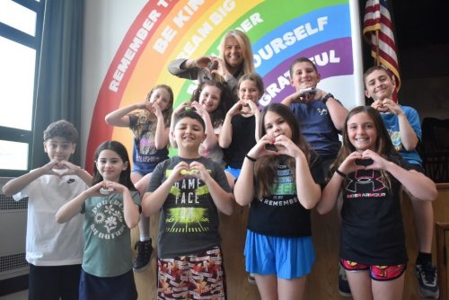 Seaford Manor Elementary School Principal Debra Emmerich is retiring in August and will miss her treasured students. One lasting impact is the cafeteria rainbow mural with the six values that are emphasized at the school. (Contributed photo)