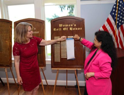 HonorRoll_B Supervisor Jennifer DeSena, Town Clerk Ragini Srivastava unveil the 2024 Women's Roll of Honor plaque.
