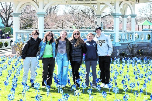 KyrasChampions_22124_A student ambassadors and Jacqueline Franchetti after setting pinwheels at Mary Jane Davies Green this spring.
(Photo by Carin Forman)