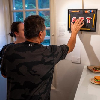 Visitors viewing the art through touch (Photos from The Art Guild)