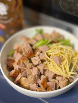 Fresh Italian sausage with canned asparagus over boxed spaghetti with olive oil and jarred garlic (Christy Hinko)