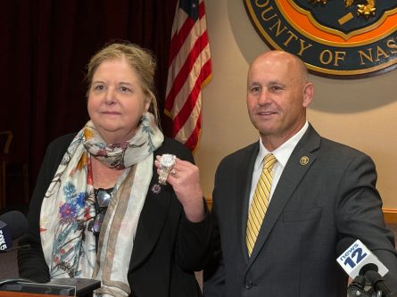 Robbery_A Nassau District Attorney Anne Donnelly, left, alongside Police Commissioner Patrick J. Ryder, displays a watch reportedly worth $275,000 that was stolen from a Greenvale jewelry store on July 17. (Photo by Michael Malaszczyk)