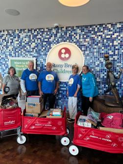 Left to right: Sue Powell, Volunteer, Sarah Grace Foundation for Children with Cancer, HJRC Rotarian Thomas Howell,
Robert Mancino, Rotary Volunteer Linda Morales and HJRC President Donna Rivera-Downey pictures with donation of
school supplies. (Photos courtesy of the Hicksville-Jericho Rotary Club)