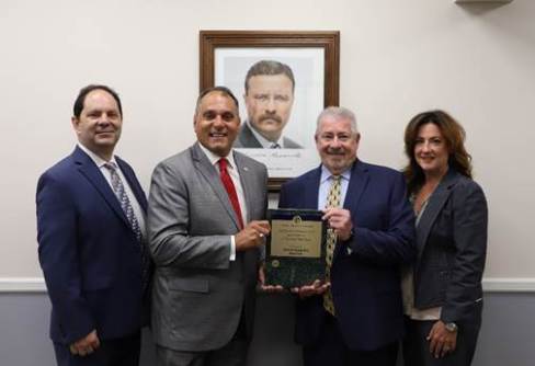 L-R Internal Audit Division Head Richard Principe, Town Supervisor Joseph Saladino, Town Comptroller Steve Ballas of Farmingdale, and Deputy Town Comptroller Christine Wiss of Massapequa Park (Photo provided by the Town of Oyster bay)