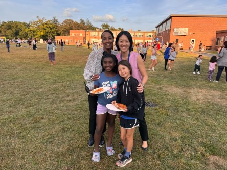24-021 East Hills Carnival Sparks Joy A Assistant Principal Jennifer Sheehan and Principal Sherry Ma with students at the Welcome Back Carnival
