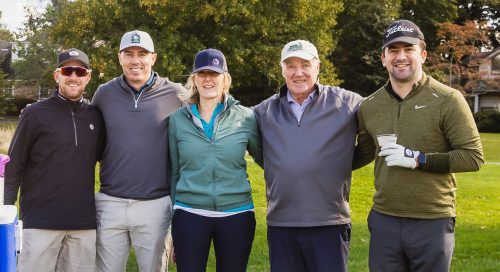 Connie O’Reilly (second from right) welcomes golfers for a break at the 5th tee, known as “Connie’s Corner” (Photo provided by the PYA)