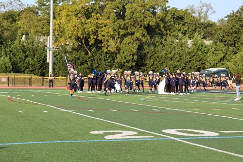 B65A7432 The Jayhawks take the field for their first game of the season.