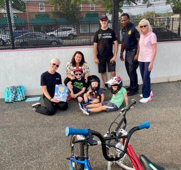 Bike Rodeo – Sept. 2024 Pictured from left to right, Port Washington Children’s Librarian Rachel Fox, Council Member Mariann Dalimonte, Bicycle Playground Owner John Pappas, Port Washington Police Sergeant Peter Griffith and Port Washington Police Commissioner Angela Mullins at the Bicycle Rodeo and Helmet Safety Event (Photo from the Town of North Hempstead)