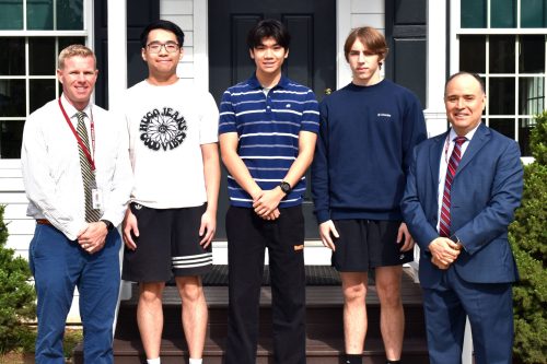 HS-NatlMeritSemifinalists1 Dan Doherty, far left, and Eric Contreras, far right, with the three North Shore National Merit semifinalists, center (Photo provided by the North Shore Central School District)