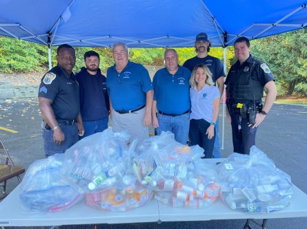 Port Washington Police officers, Port Washington Water District Commissioners and servicers at last year’s Pharmaceutical Take Back Day event (Photo from the Port Washington Water District)