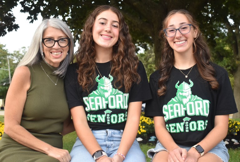 Principal Nicole Schnabel congratulates Anastasia and Ava on their achievement. (Photos courtesy of the Seaford School District)