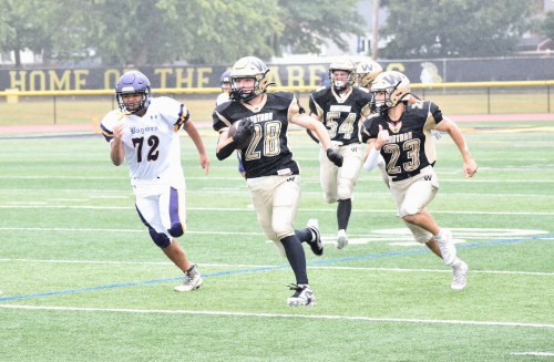The Wantagh Warriors charged onto the field for the homecoming game on Sept. 28, a
dominating 49-0 victory over the Oyster Bay Baymen. (Photos courtesy of the Wantagh School District)